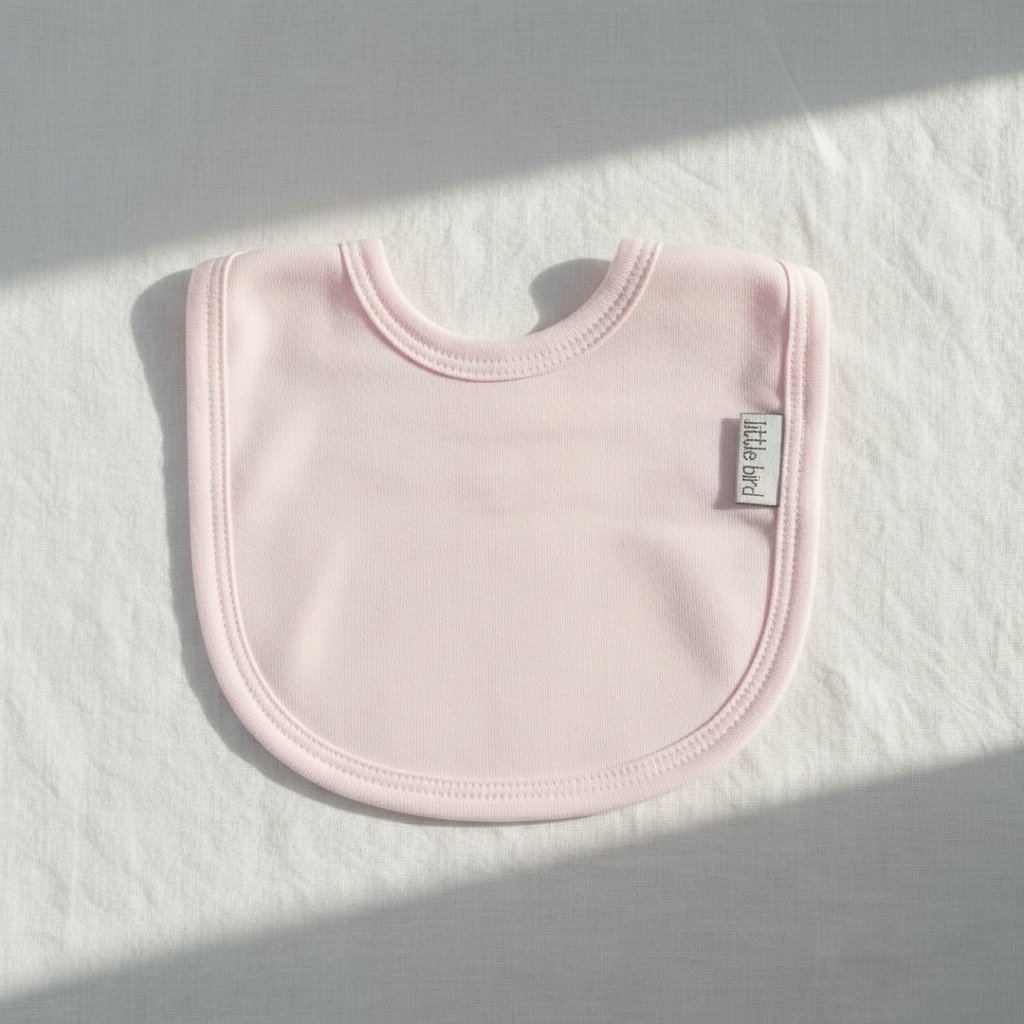 Flat lay bavetta rosa Little Bird